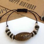 Macrame Adjustable Bracelet - Unique Bronze Imprinted Oval Acrylic Bead & Tibetan Silver